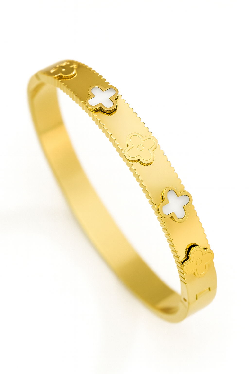Gold bracelet with cross designs on a white background