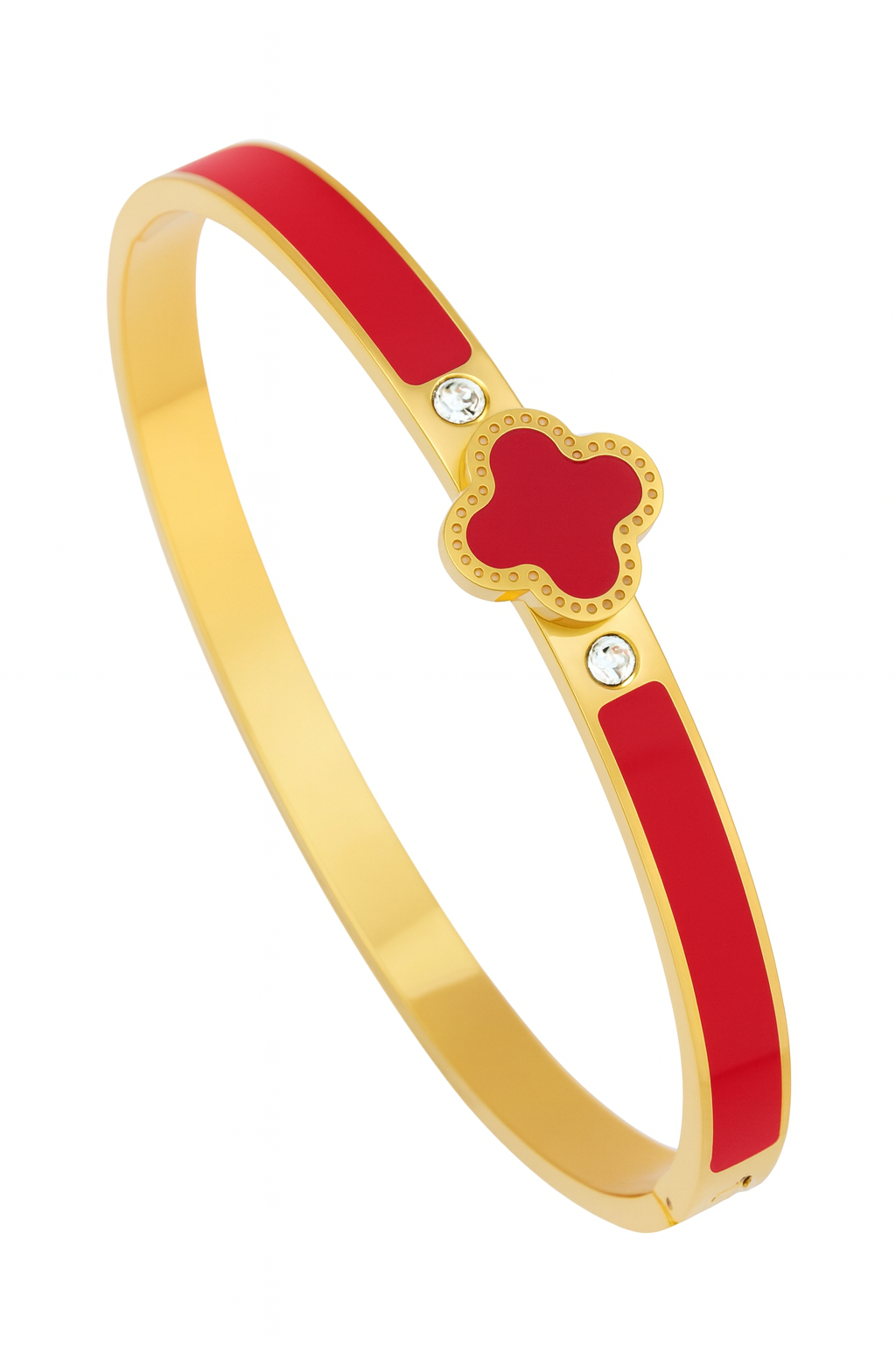 Gold bracelet with a red clover shaped center on a white background