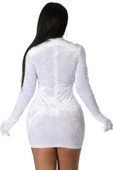 Woman wearing a white crushed velvet long-sleeve bodycon mini dress with a mock neck and glove-style sleeves, showcasing a soft, textured finish.