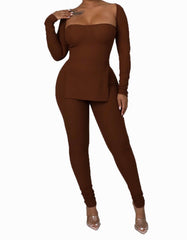 Woman wearing a brown two-piece set featuring a long-sleeve, bustier-style top with an asymmetric hem and matching high-waisted fitted leggings.