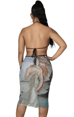 Woman wearing a halter cut-out midi dress featuring Botticelli’s "The Birth of Venus" art print with side cutouts and a body-hugging silhouette.